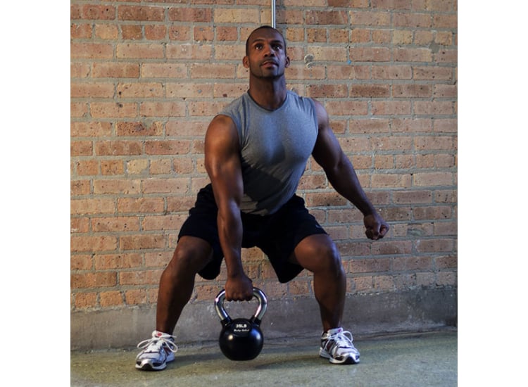 Man Using Body-Solid- Kettlebell for Workout
